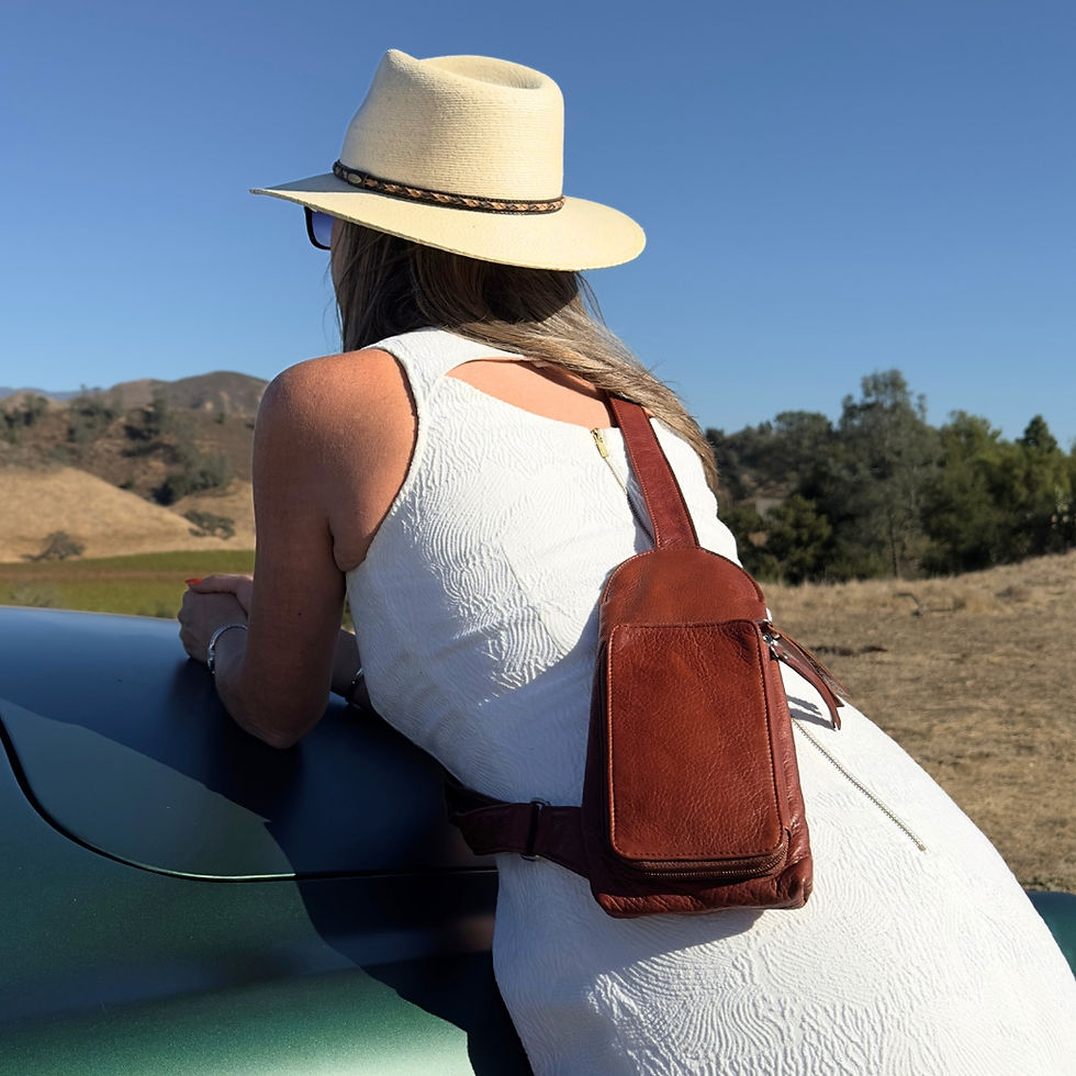 Thumbnail: Osgoode Marley Rey Leather RFID Sling Bag in Brandy back on model