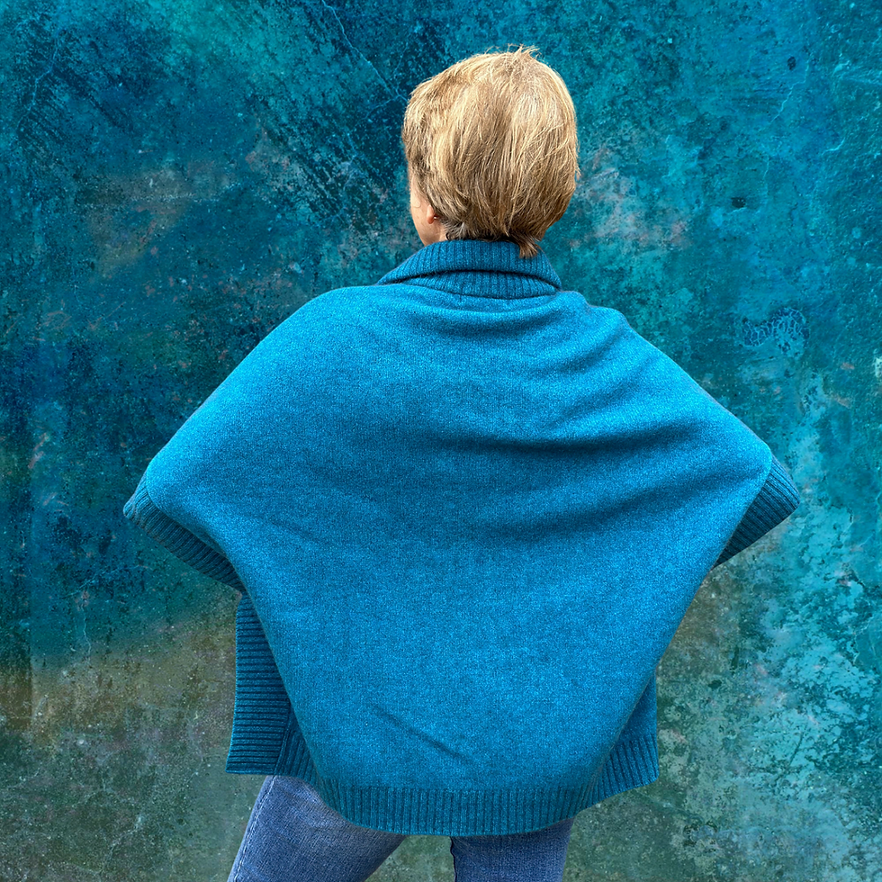 Koru Knitwear of New Zealand Knitted Buttoned Short Cape in Pacific back