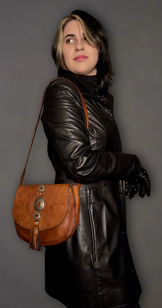 Elena modeling the Campomaggi Linda Cognac leather shoulder bag with decorative metal accents and leather tassel.