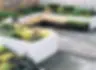 white flower beds with fencing panels all made with AAC