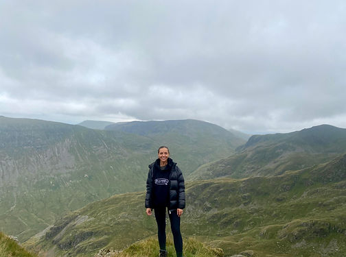 Shannon Fearon in the Lake District, England, looking over a cloudy sky