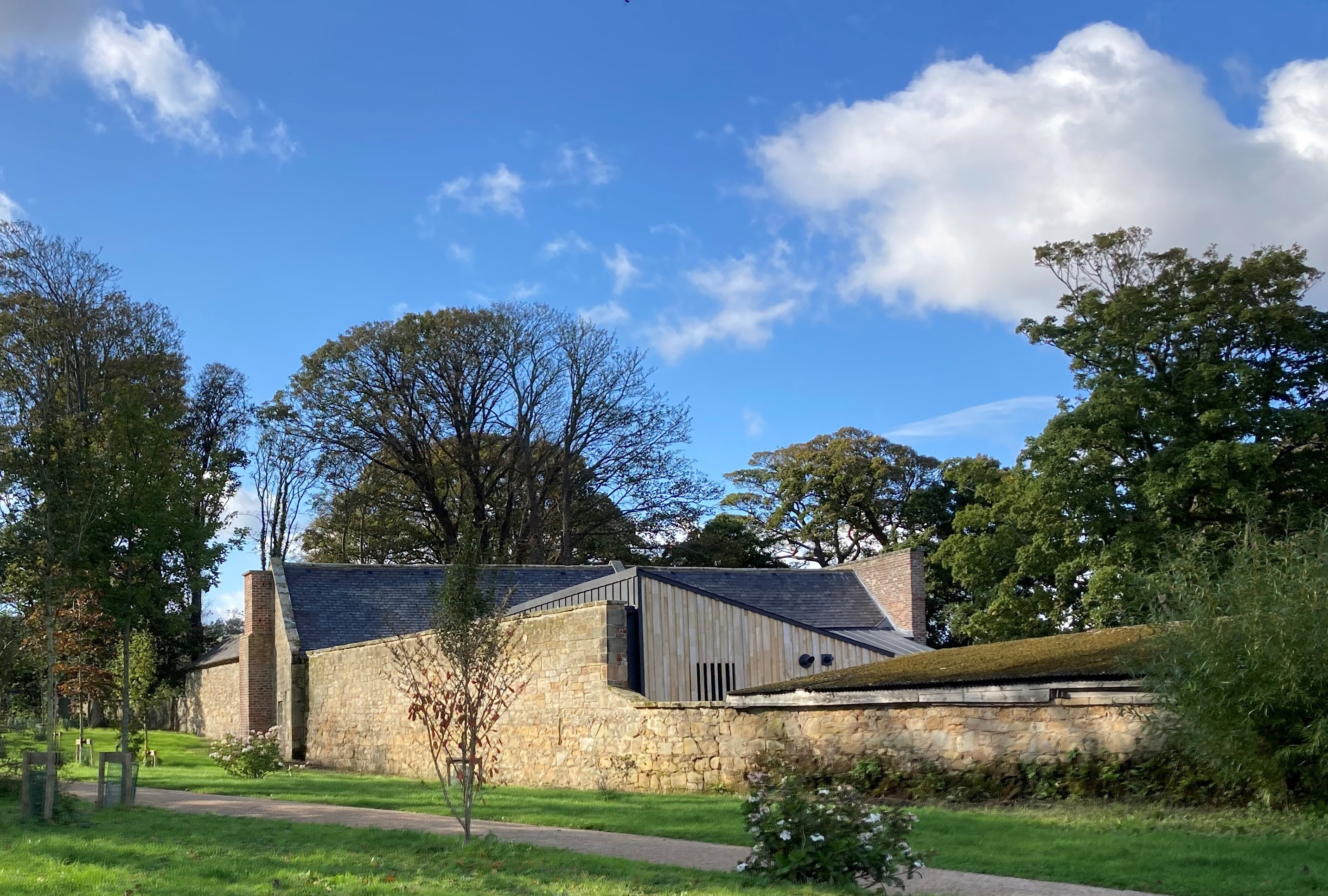 Mosedale Gillatt Architects Ltd — A view over the pleasure garden wall to the Brewhouse cafe at Seaton Delaval Hall