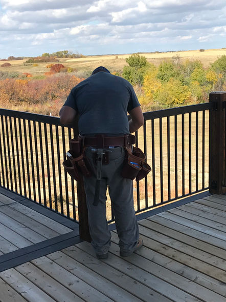 Man installing metal handrail