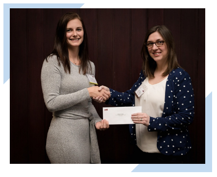 Sharon Janes of Integrated Informatics in St. John's, NL hands scholarship award to Victoria Pollard, Engineering student at Memorial University of Newfoundland.