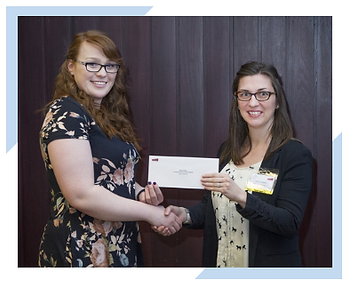 Sharon Janes of Integrated Informatics in St. John's, NL hands scholarship award to Sara Foley, Engineering student at Memorial University of Newfoundland.