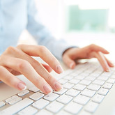 close-up-employee-with-computer-keyboard.jpg