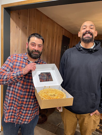 Micah and Josh holding an apple pie 