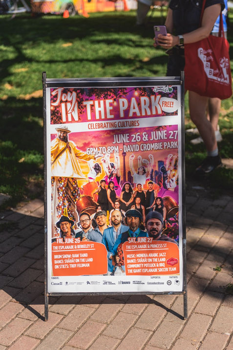 Jamii's Joy in the Park event sign in David Crombie Park on The Esplanade in Toronto.