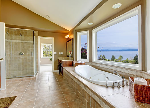 Large bath tun with water view and luxury bathroom interior in beige colors..jpg