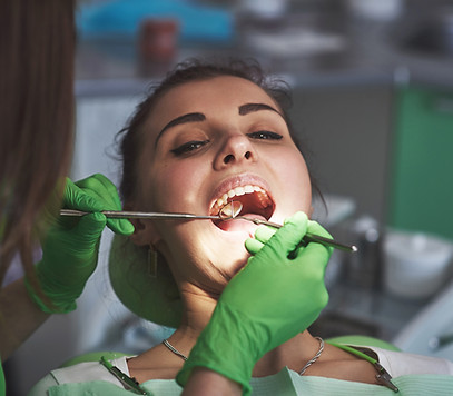 dentist-curing-a-female-patient-in-the-stomatology-2026-01-08-23-27-05-utc.jpg