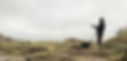 A panoramic view of a young White woman wearing a toque and hiking clothes with a border collie.
