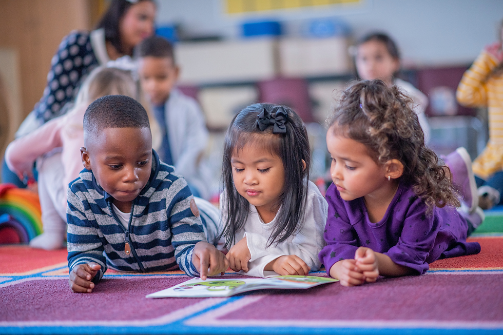 Diverse children reading together in a classroom using multicultural and inclusive children’s books.