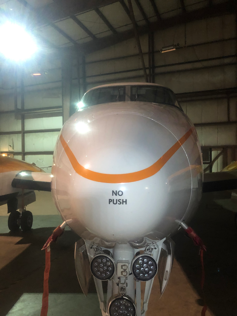 Close up of the exterior nose of Beechcraft B300 King Air aircraft that read “no push”