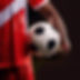 close-up of a soccer player wearing red and white kit holding a soccer ball_ 24-01-2025 at