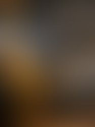 A close‑up of a dark, cracked ceramic bowl being repaired with molten gold. A thin stream of glowing liquid gold pours into the jagged fissure, filling it with light and creating a radiant golden seam — symbolizing kintsugi healing, restoration, and the beauty of mending broken places.