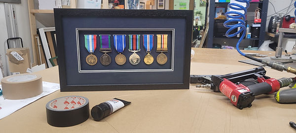 3D picture frame containing war medals