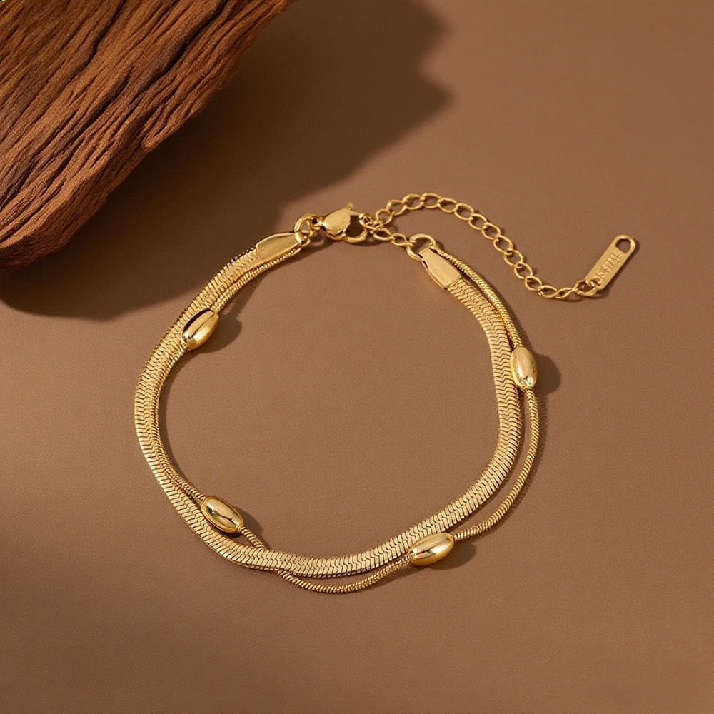 Pulsera tipo serpiente balines anchos dorada 