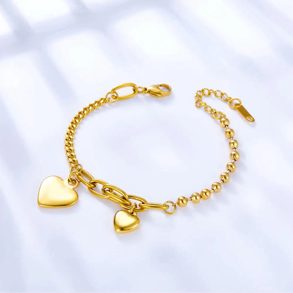 Pulsera dorada cubana y balines 2 corazones 