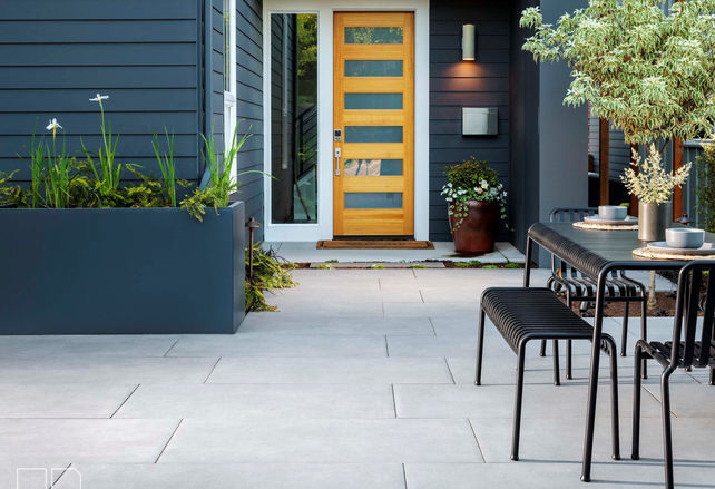 Modern front entry porcelain paver walkway and patio with clean lines in Seattle, WA