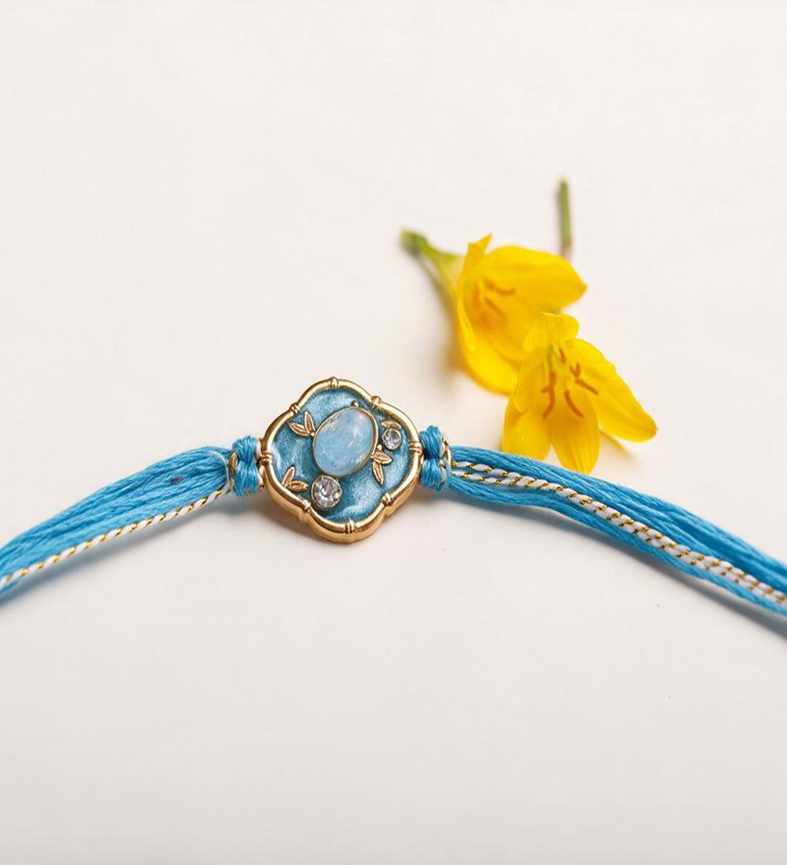 Blue Diamond Stone Embellished Rakhi made with Anchor Non-Bleeding Cotton Thread