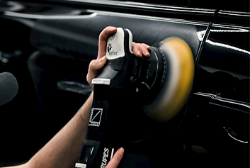 a man is working on a car radio_edited.png