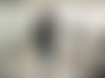 A confident business leader strides through a modern office space, embodying effective leadership and showcasing the importance of leadership development solutions in fostering emerging leaders. The atmosphere reflects a commitment to organizational behavior and the growth of leadership skills essential for successful teams and business strategy.