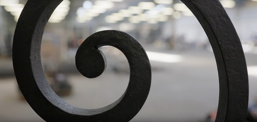 Hand forged scroll