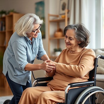 ethnic caregiver caring for a person in a wheelchair in their home