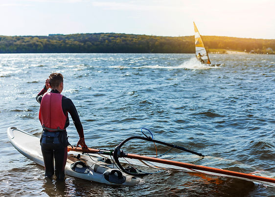 young-man-with-kitesurf-board.jpg