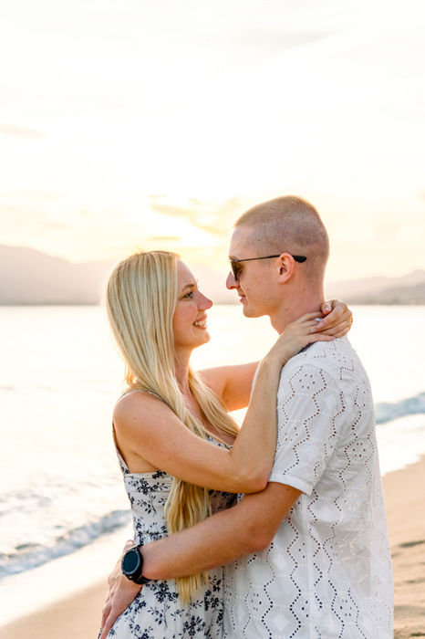 Couple embracing on the beach at golden hour in Cannes during a photo shoot with The Bercans Photography.