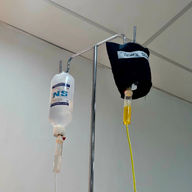 A bag of saline solution and a curcumin IV