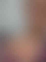 Red skin reaction on face and shoulder, woman wearing a colorful singlet