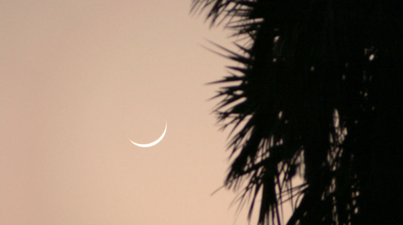 The African moon lying on her back...