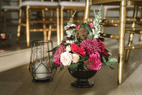 Step into the captivating world of L&S's wedding, where elegance seamlessly intertwined with simplicity, all set against the stunning
backdrop of the ocean. The bride truly stole the show, donning exquisite pink lace shoes and delicate crystal flowers in her hair, embodying the essence of romance. The ceremony itself exuded charm, beautifully by the dramatic contrast of dark colours blended
harmoniously with soft whites, creating a perfect romantic ambience for their special day. Each table was meticulously designed to a bold statement, showcasing luxurious black linens, elegant black charger plates, gleaming gold flatware, and striking black glassware, all contributing to the sophisticated aesthetic that the bride & groom envisioned. The floral were nothing short of mesmerizing, featuring deep, moody tones with a stunningly romantic touch to the overall atmosphere, making it a day to remember.
We created stunning custom wedding invitations in full colour with a luxurious soft touch and exquisite digital gold foil accents. Our one-of-a-kind wedding signage in dark, moody colours made a bold statement, adding elegance to their special day. Delighted guests had round custom wedding menus with amazing digital gold print that sparkled beautifully on each table.
Decorate your wedding with unique designs that reflect your personal style. From invitations to decor, our creations will make your day unforgettable. Celebrate love in a way that’s uniquely yours with our elegant creations.