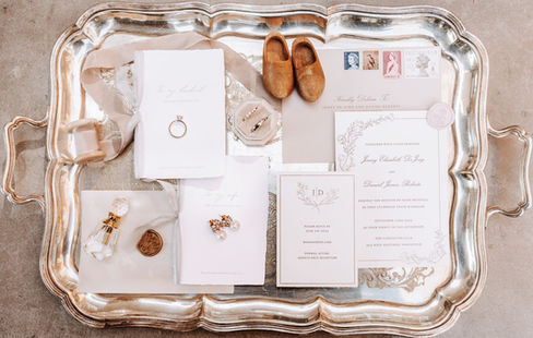 Jenny and Dan's Wedding took the best parts of classic and traditional with a gorgeous spring garden. 
White Cotton Wedding Invitations printed in Letterpress with a light Beige Envelope. The flowers were a wild garden with whites, greenery and bright pops of colours. White Linens with antique silver charger plates and custom menus for each guest created the perfect royal garden party wedding.