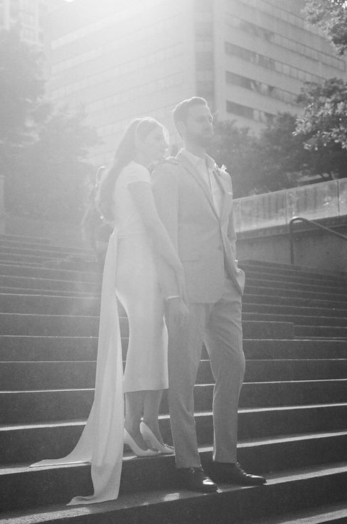 Maryam & Noel's Wedding was a dream of romantic opulence meets garden party. The most gorgeous details with whimsical spring flowers, royal charger plates, gold flatware, crystal stemware, and romantic pastel colours. “The colours of the floral arrangements were inspired by the works of Monet and Renoir,” says the bride. Stone fruit and grapes, inspired by still life paintings, to the table décor and chandeliers hanging from the trees, every detail was perfectly curated.
Maryam and Noel's custom wedding stationery was an exquisite collection that truly captured their special day. Each piece was thoughtfully designed to convey the perfect tone for each aspect of their wedding. The custom ceremony program fans not only highlighted the beautiful details of their ceremony but also provided a refreshing breeze for guests in the summer warmth, featuring watercolour florals in blue, pink, and white with subtle greenery accents on the scalloped edge. Guests were welcomed
with delicious canapes presented on charming custom canape cards adorned with a hand-drawn wreath, while their love of travel inspired the stunning custom seating charts displayed in delightful glass jars. Guest sat down for dinner to a personalized wedding menu, beautifully bordered with delicate watercolour flowers, perfectly complementing the table decor.
Let your guests experience something as unique as you are with your own custom wedding stationery!

​As seen in BRIDES Magazine