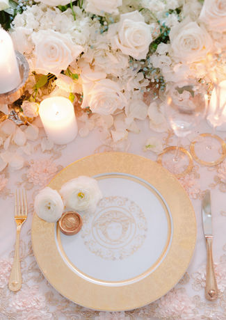 This styled shoot captures the essence of French royalty, merging dreamy romanticism with sophisticated elegance. The extravagant tablescape features exquisite Versace tableware and a lavish floral runner, creating a visual delight. Be sure to admire the breathtaking architectural details of the wedding cake.