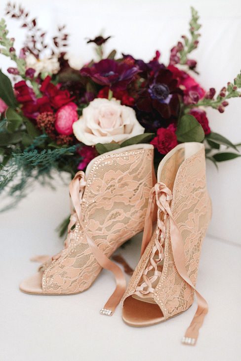 Step into the captivating world of L&S's wedding, where elegance seamlessly intertwined with simplicity, all set against the stunning
backdrop of the ocean. The bride truly stole the show, donning exquisite pink lace shoes and delicate crystal flowers in her hair, embodying the essence of romance. The ceremony itself exuded charm, beautifully by the dramatic contrast of dark colours blended
harmoniously with soft whites, creating a perfect romantic ambience for their special day. Each table was meticulously designed to a bold statement, showcasing luxurious black linens, elegant black charger plates, gleaming gold flatware, and striking black glassware, all contributing to the sophisticated aesthetic that the bride & groom envisioned. The floral were nothing short of mesmerizing, featuring deep, moody tones with a stunningly romantic touch to the overall atmosphere, making it a day to remember.
We created stunning custom wedding invitations in full colour with a luxurious soft touch and exquisite digital gold foil accents. Our one-of-a-kind wedding signage in dark, moody colours made a bold statement, adding elegance to their special day. Delighted guests had round custom wedding menus with amazing digital gold print that sparkled beautifully on each table.
Decorate your wedding with unique designs that reflect your personal style. From invitations to decor, our creations will make your day unforgettable. Celebrate love in a way that’s uniquely yours with our elegant creations.