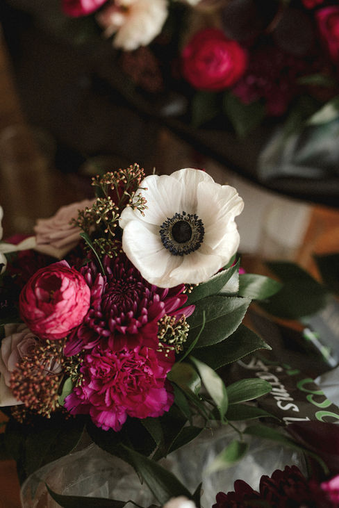 Step into the captivating world of L&S's wedding, where elegance seamlessly intertwined with simplicity, all set against the stunning
backdrop of the ocean. The bride truly stole the show, donning exquisite pink lace shoes and delicate crystal flowers in her hair, embodying the essence of romance. The ceremony itself exuded charm, beautifully by the dramatic contrast of dark colours blended
harmoniously with soft whites, creating a perfect romantic ambience for their special day. Each table was meticulously designed to a bold statement, showcasing luxurious black linens, elegant black charger plates, gleaming gold flatware, and striking black glassware, all contributing to the sophisticated aesthetic that the bride & groom envisioned. The floral were nothing short of mesmerizing, featuring deep, moody tones with a stunningly romantic touch to the overall atmosphere, making it a day to remember.
We created stunning custom wedding invitations in full colour with a luxurious soft touch and exquisite digital gold foil accents. Our one-of-a-kind wedding signage in dark, moody colours made a bold statement, adding elegance to their special day. Delighted guests had round custom wedding menus with amazing digital gold print that sparkled beautifully on each table.
Decorate your wedding with unique designs that reflect your personal style. From invitations to decor, our creations will make your day unforgettable. Celebrate love in a way that’s uniquely yours with our elegant creations.