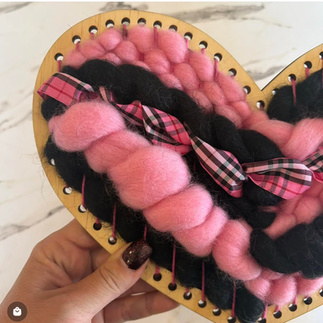 Black and pink woven heart shaped loom 