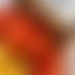 mustard warp on dark wooden bobbin