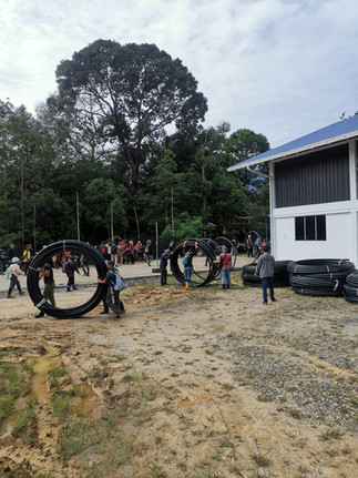 Overview of rural villagers working together to execute their community water project