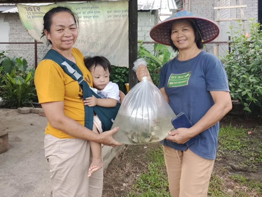 Rural farmers excited to farm fish, boosting their families' long-term nutrition and health.