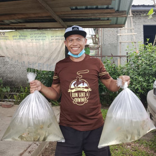 rural farmer and his newly received fish fry to start fish farming.