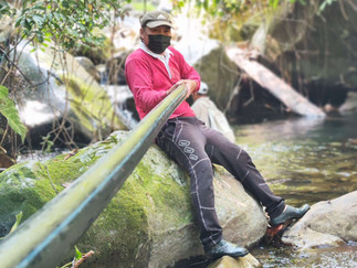 rural villager helping to carry water pipelines