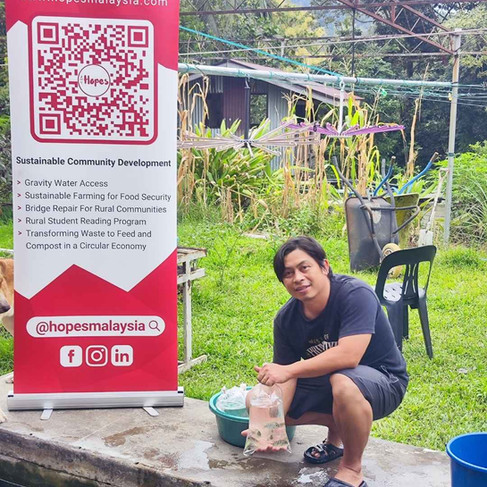 rural farmer with his newly received small fishes ready to release it to the pond