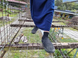 Close-up of the worn-out suspension bridge.
