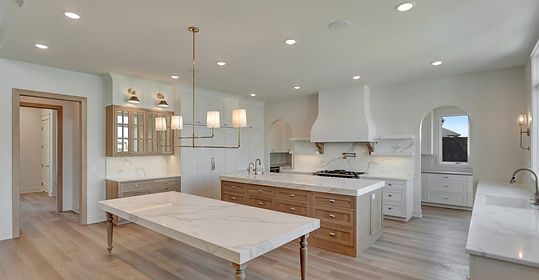 Luxury custom kitchen with oversized island and lake views