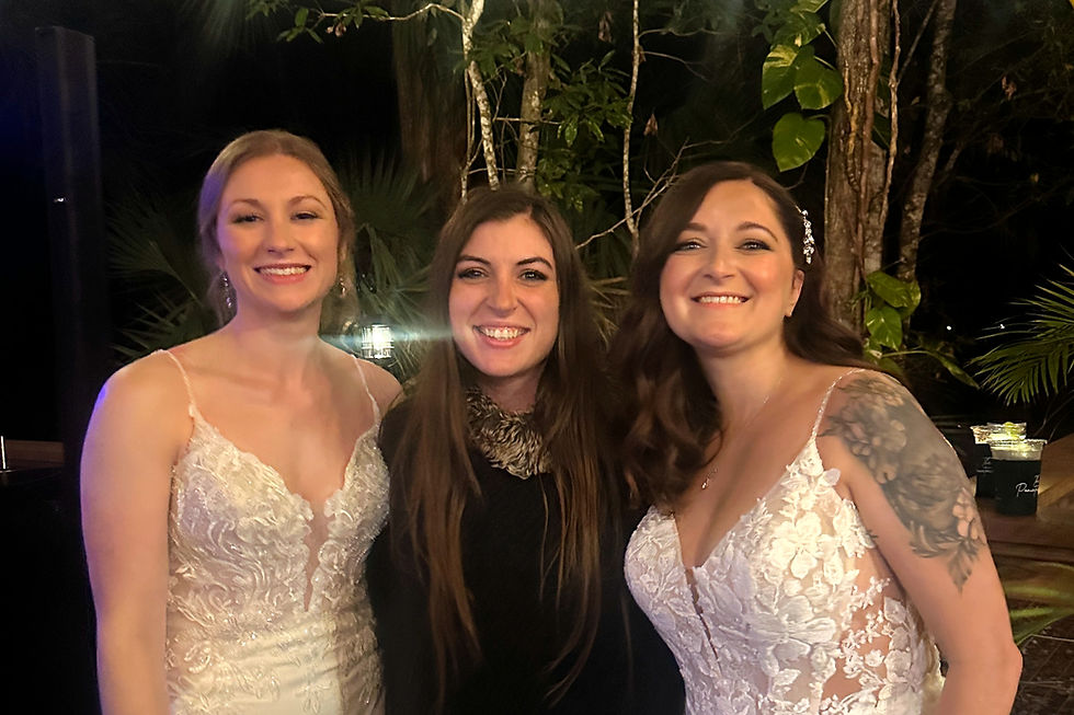Chrystalline Gold celebrating with a wedding couple after their Florida reception