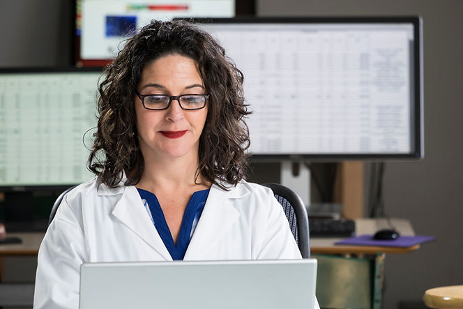 A photo of a sonogram technician and her patient